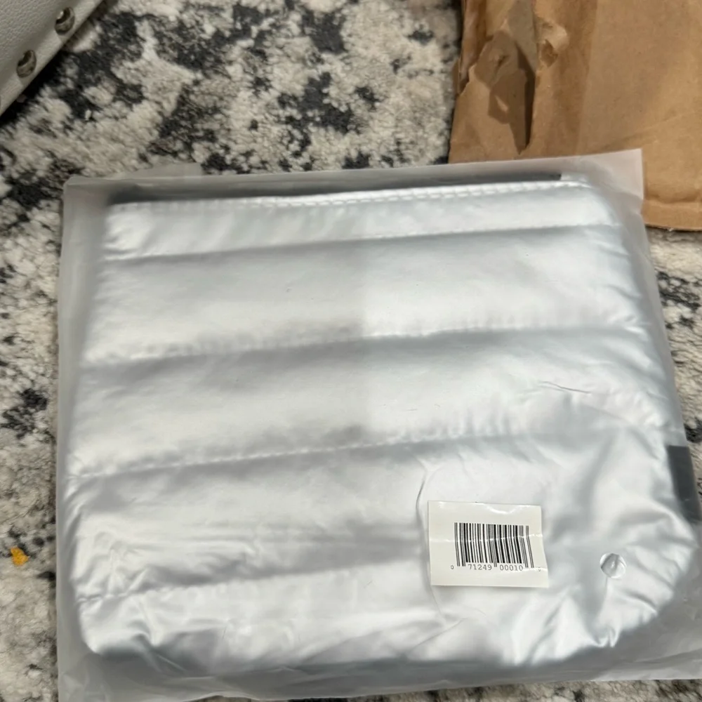 L’Oréal Paris Silver Puffer Cosmetic Pouch